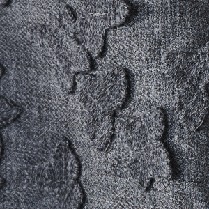 Allover superpose flower embroidery on light wool melange base