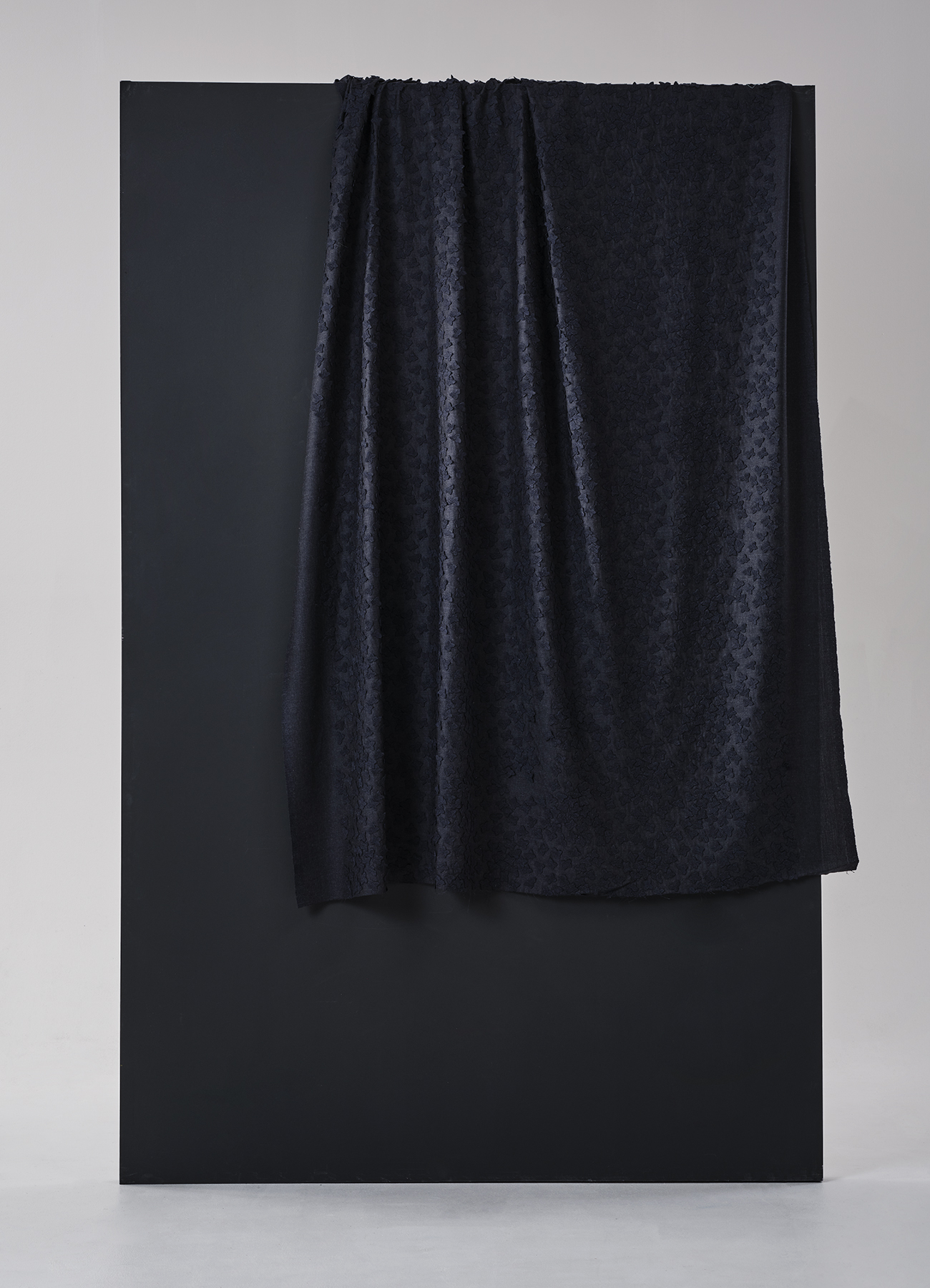 Allover superpose flower embroidery on light wool melange base