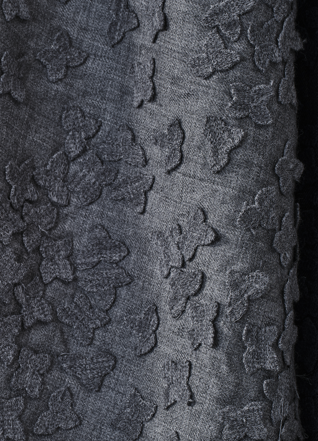Allover superpose flower embroidery on light wool melange base