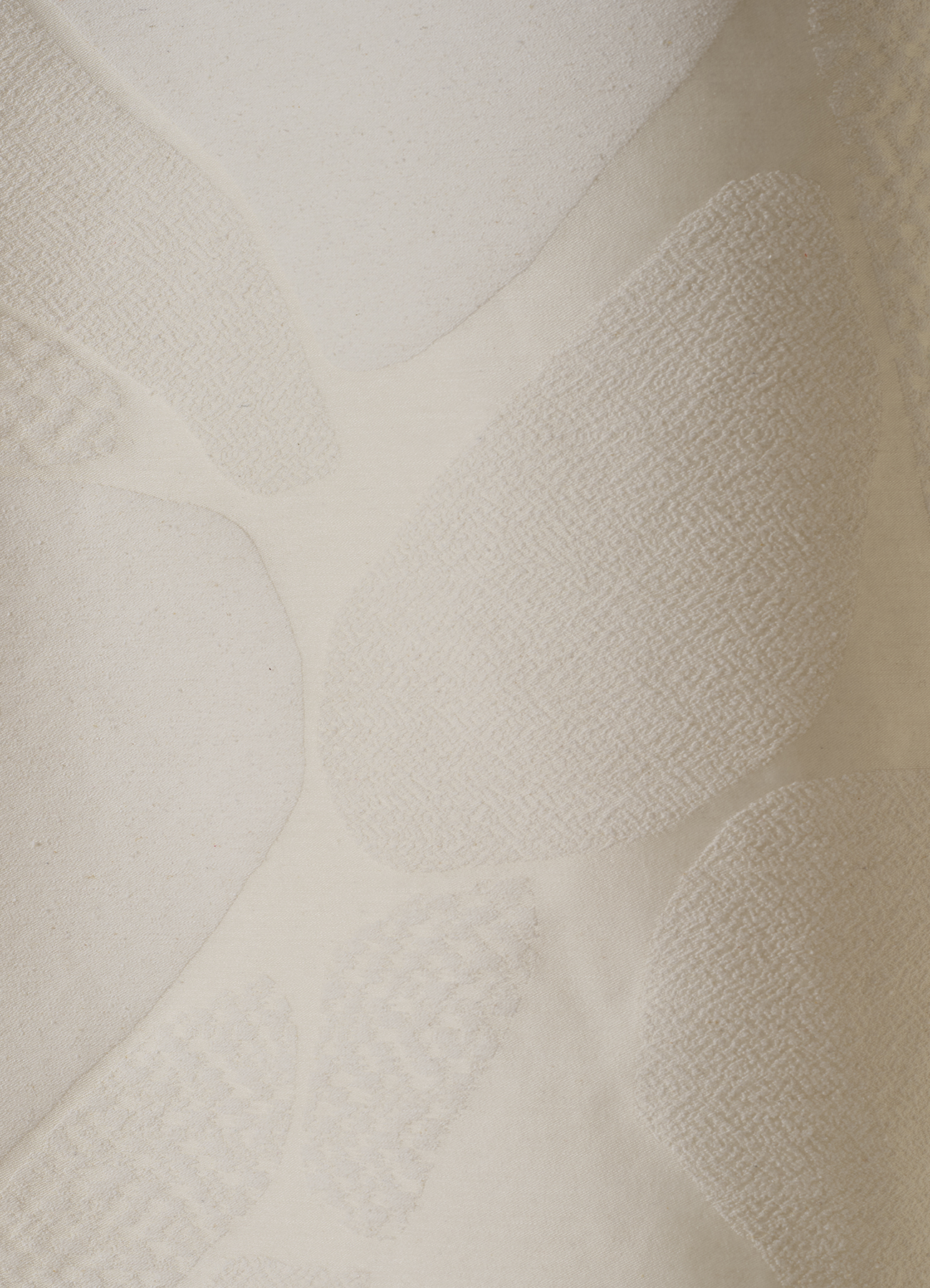 Multi-textured surface with allover design inspired by stones