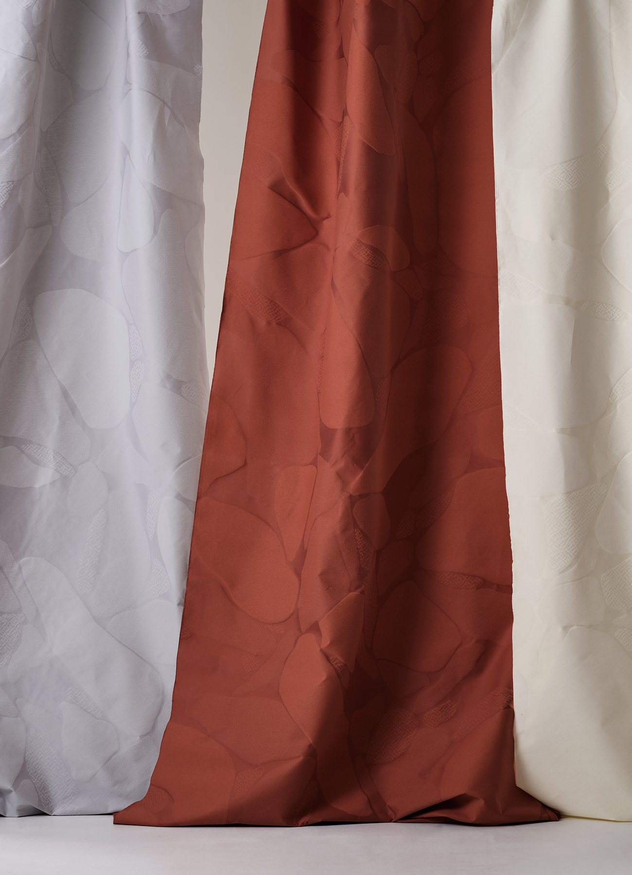 Multi-textured surface with allover design inspired by stones